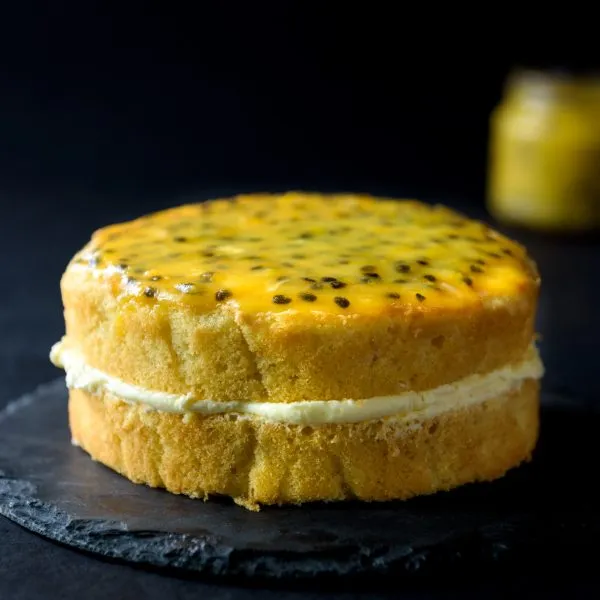 Sponge cake with citrusy buttercream and topped with passion fruit curd