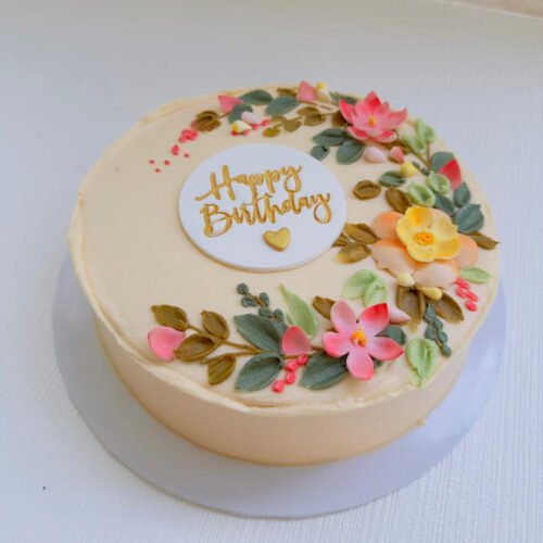 ribbon cake covered in butter icing